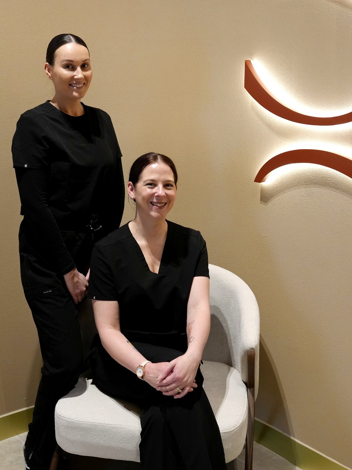 Rhianna and Melissa of Solsera Estetica in the clinic's Noosa reception